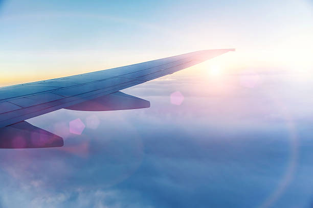 istock Wing of the plane on blue sky background 479149136