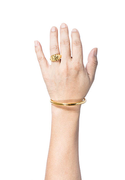 istock hand with golden ring and bracelet 479149674