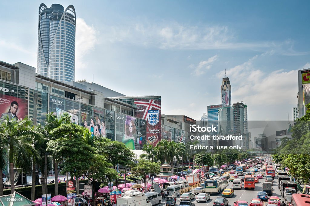 Central Bangkok Skyline Bangkok, Thailand - June 23, 2011: Heavy traffic on Thanon Ratchadamri road with skyscrapers and modern shopping malls in the background in the centre of Bangkok, Thailand. 2015 Stock Photo