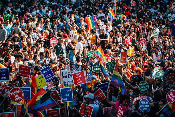 LGBT Pride Istanbul Istanbul, Turkey - June 28, 2015: Thousands of revelers joined for the annual Gay Pride Pride in Cihangir, Taksim, Beyoglu, Istanbul showing off a multitude of colorful flags and placards calling for equal rights and justice for LGBT related crime. There were also small protests for other causes. transgender protest stock pictures, royalty-free photos & images