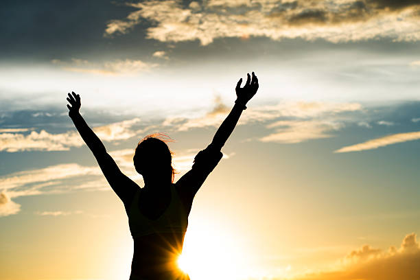 istock strong confidence woman open arms under the sunrise at seaside 479151436