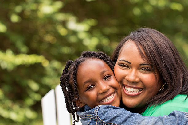 istock Mother laughing and hugging her daughter 479153970