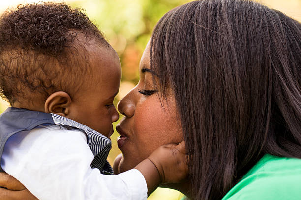 istock African American mother holding her son. 479153974