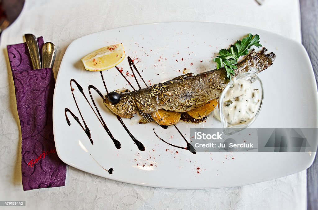 Grilled fish in a French restaurant Beautiful grilled fish in a French restaurant 2015 Stock Photo