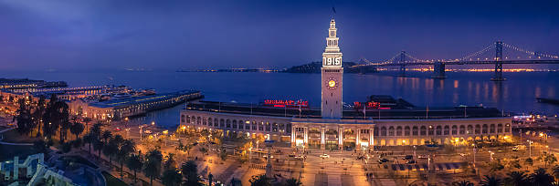 san francisco ferry building - san francisco county skyline panoramic night fotografías e imágenes de stock