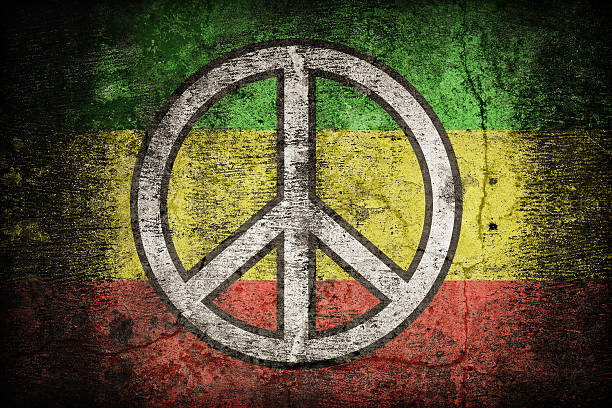 istock Rasta flag pattern with a peace on dirty old concrete 479156430