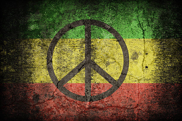 istock Rasta flag pattern with a peace on dirty old concrete 479156652