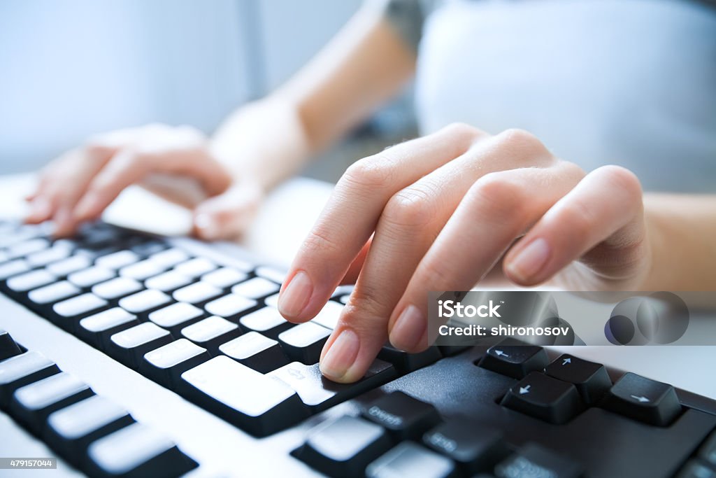 Pressing enter button Close-up of female hand pressing enter key to start the system Computer Keyboard Stock Photo