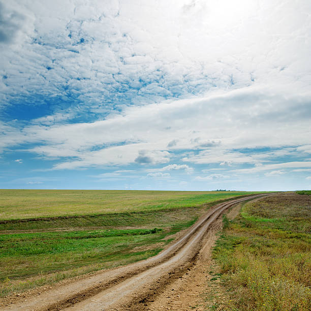 istock rural road and cloudy sky 479157531