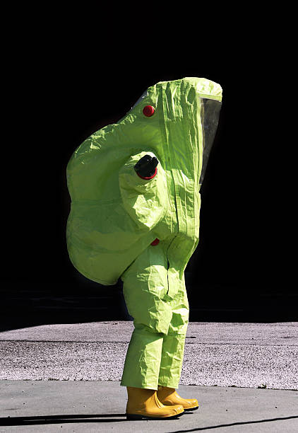 istock person with yellow protective suit, anti-glare to avoid counting 479158624
