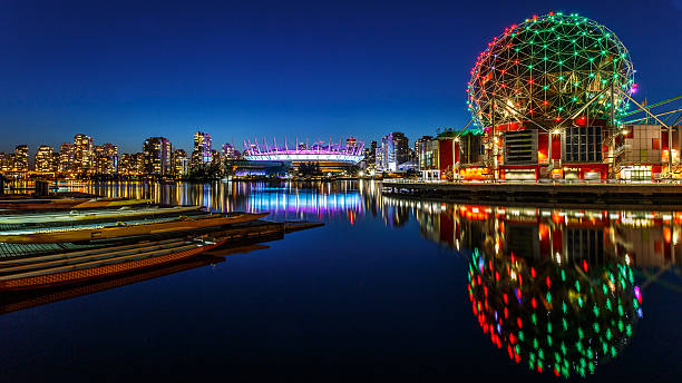 False Creek in Vancouver, Canada Science World and BC Olympic Place illuminated at night in Vancouver, Canada vancouver at night stock pictures, royalty-free photos & images