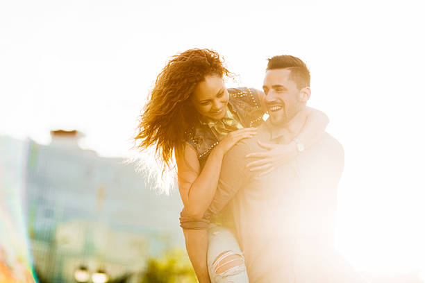 istock Young cheerful couple having fun while piggybacking at sunset. 479164770