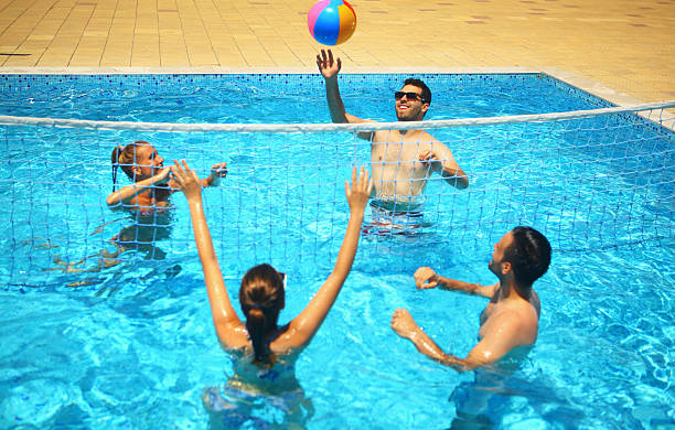 istock Friends playing volleybay in a pool. 479164922