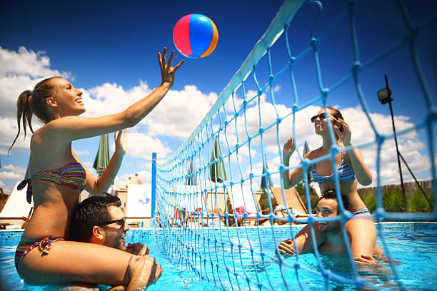 istock Friends playing volleybay in a pool. 479164924