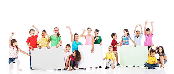 istock Group of excited children holding white papers. Copy space. 479165402