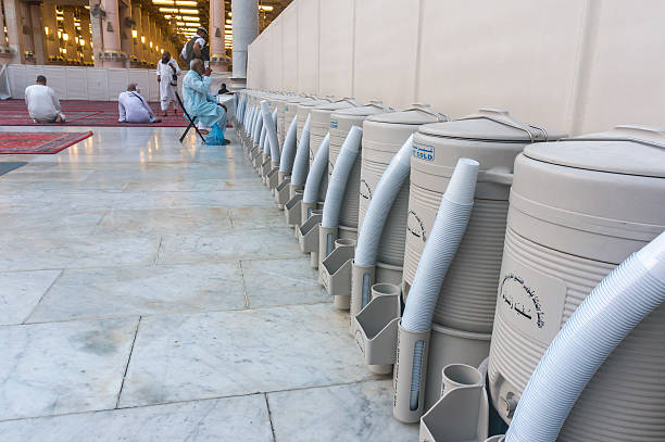 Zam water Medina, Saudi Arabia - March 9, 2015: Rows of drums of zamzam water inside Nabawi mosque. Zamzam water are freely and available in abundant here muhammad prophet photos stock pictures, royalty-free photos & images