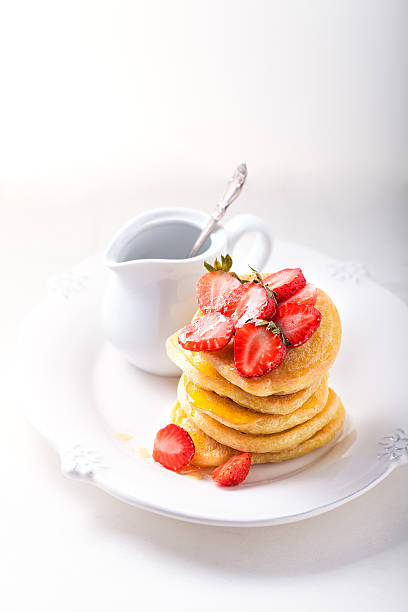 istock Stack of sweet pancakes with strawberry and honey. 479166438