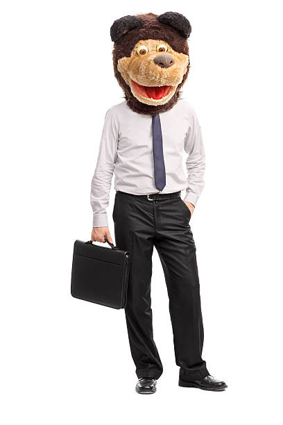 istock Silly businessman wearing a childish bear mask 479169498