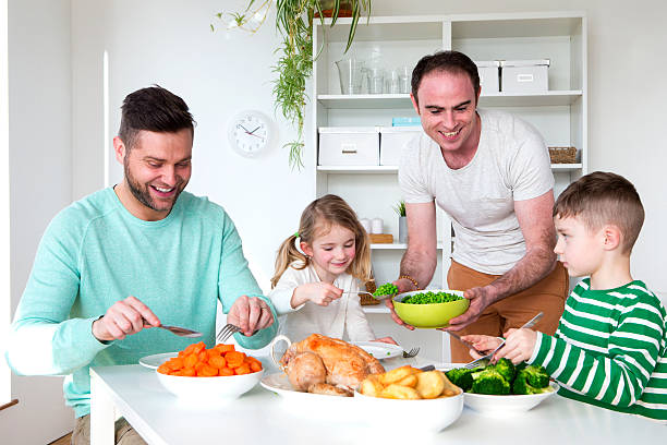 istock Male couple having dinner with their son and daughter 479170906