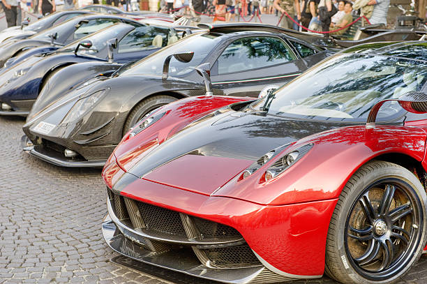 Pagani Huayra with other Pagani supercars in an Italian Piazza. Verona, Italy - June, 21 2014: Pagani Huayra in a lineup of other Pagani supercars. Part of a display of Pagani, Lamborghini, Mercedes and Ford Supercars in Piazza Bra. exoticism stock pictures, royalty-free photos & images