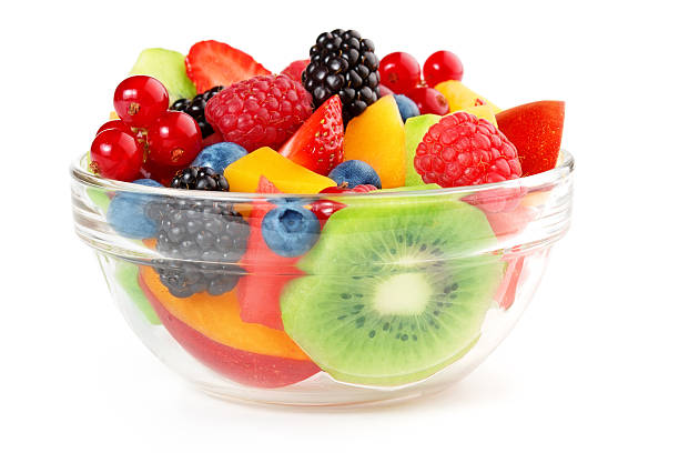 fresh and healthy fruit salad bowl of fruit salad isolated on white background fruit salad stock pictures, royalty-free photos & images