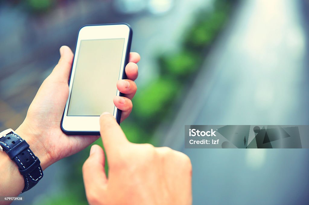 young asian woman hands use smartphone at city 2015 Stock Photo