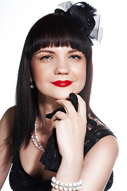 istock Portrait smiling brunette with white pearls and gloves 479178082
