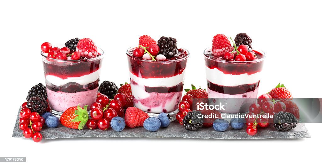perfect fruit app glasses with layered dessert and soft fruit on slate Blue Stock Photo