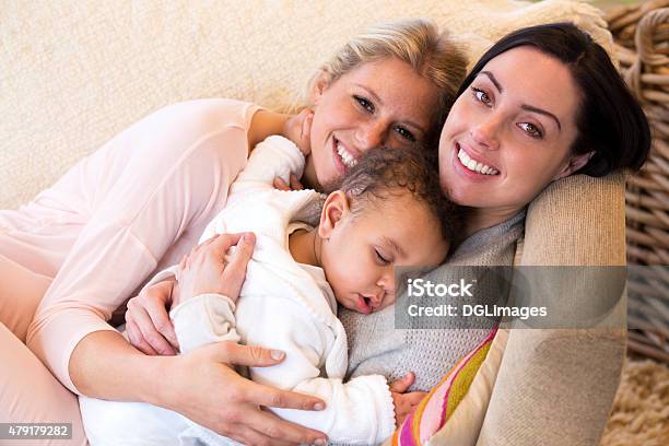 Female Couple Cuddling With Their Baby Son Stock Photo - Download Image Now - Lesbian, Baby - Human Age, Gay Person