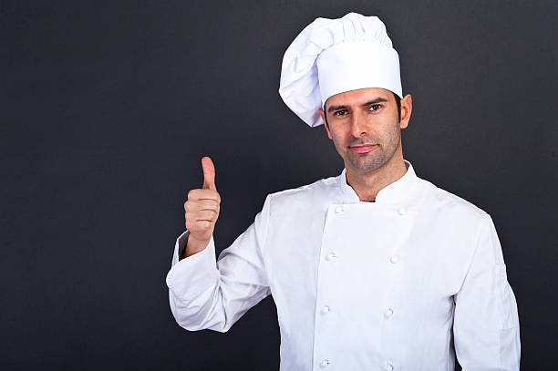 istock Male chef with thumb up portrait against grey background 479181103