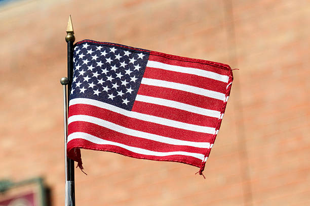istock Small American Flag on an antenna with brick 479181914