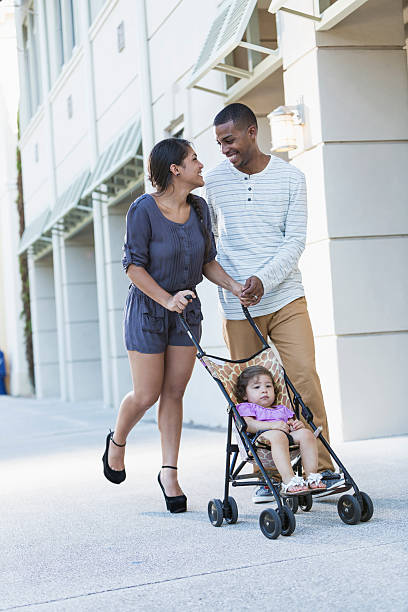 istock Young family with baby in stroller 479182457