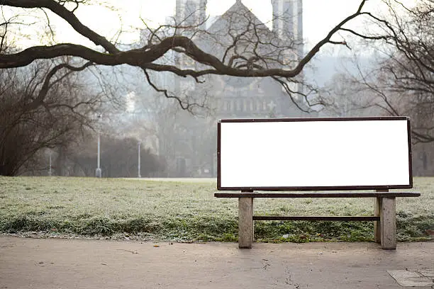 Photo of Blank billboard on bench at city park