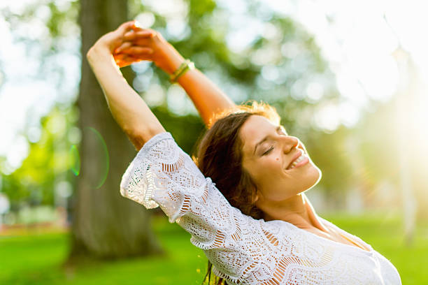 istock Mixed race woman feeling freedom at sunset 479182723