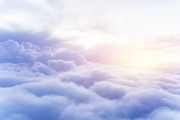 Sunny sky abstract background, beautiful cloudscape, on the heaven, view over white fluffy clouds, freedom concept