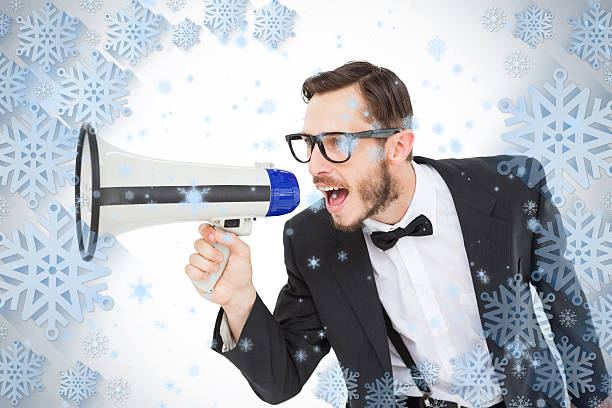 geeky, empresário gritando através de megafone - winter public speaker megaphone snow - fotografias e filmes do acervo