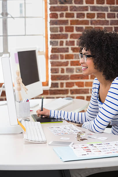istock Female photo editor using digitizer in office 479184950