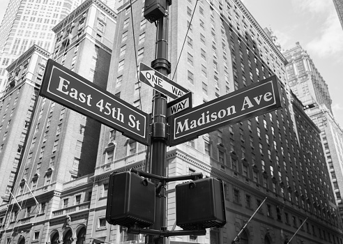 A closeup to signs for East 45th and Madison Avenue in New York City