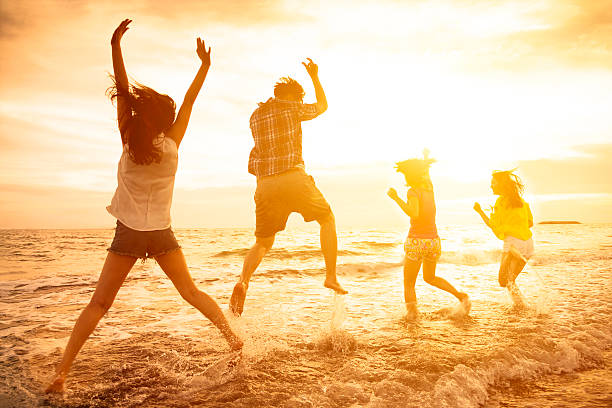 istock group of happy young people dancing on the beach 479185950