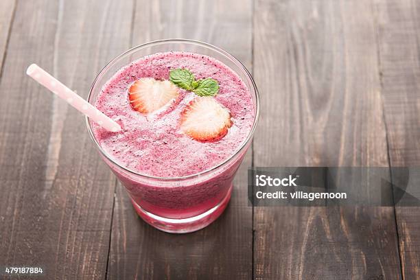 Strawberry Fruit Smoothies With Straw On Wooden Background Stock Photo - Download Image Now