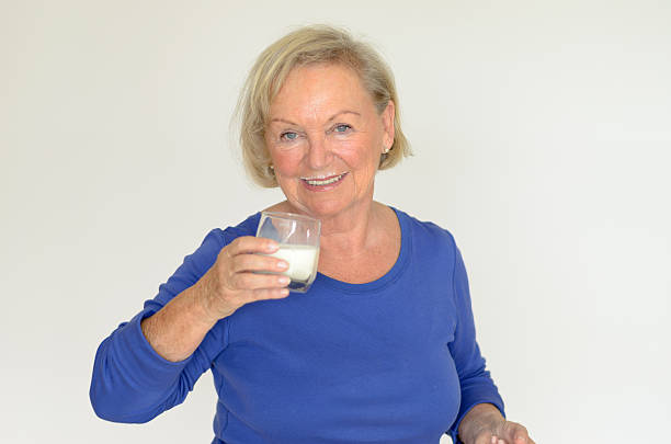 istock Healthy senior lady drinking fresh milk 479188340