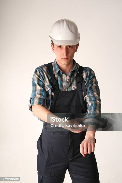 Portrait Of The Young Man Of The Civil Engineer Stock Photo - Download Image Now - 2015, Adult, Bib Overalls