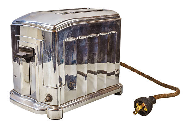 Old bread toaster isolated on white Old chrome bread toaster isolated on a white background kitchen utensil antique toaster old stock pictures, royalty-free photos & images