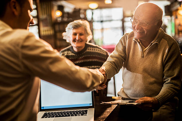 istock Happy old people come to an agreement with insurance agent. 479191738