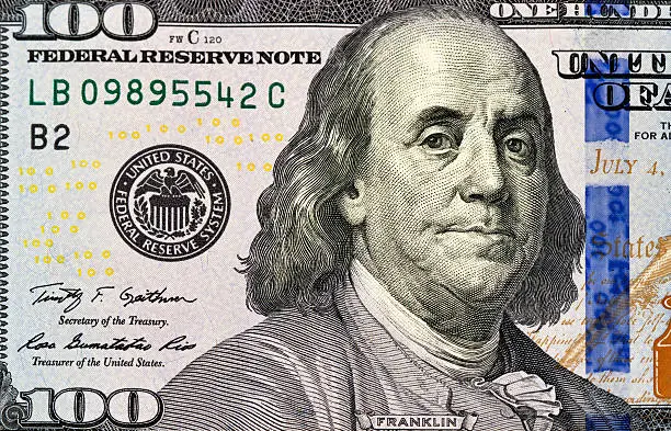 Portrait of Benjamin Franklin from one hundred dollars bill new edition macro