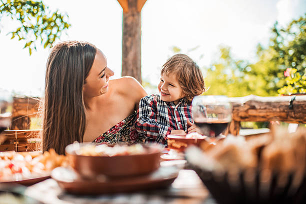istock Happy mother and son communicating during lunch in a restaurant. 479195110