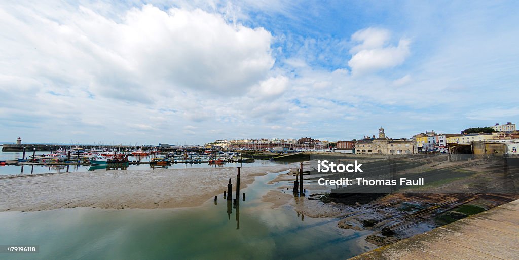 Ramsgate Harbour - low tide A view across Ramsgate Harbour, Thanet, Kent. Popular tourist and fishing location. Logos removed. 2015 Stock Photo