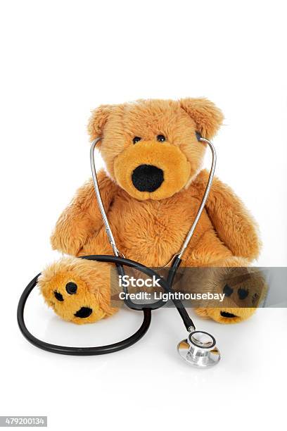 Teddy Bear With A Stethoscope On White Background Stock Photo - Download Image Now - Pediatrician, 2015, Brown