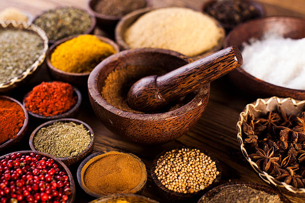 istock Spices and herbs in wooden bowls. 479200780