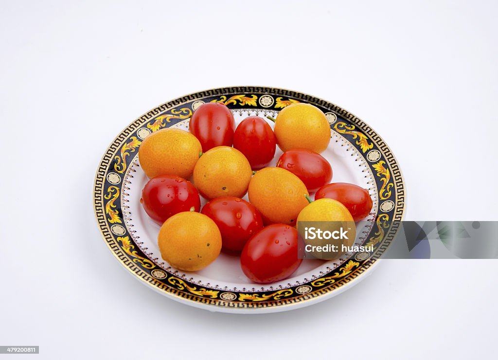 Фрукты: Маленький оранжевый и помидоры Черри - Стоковые фото Близость роялти-фри
